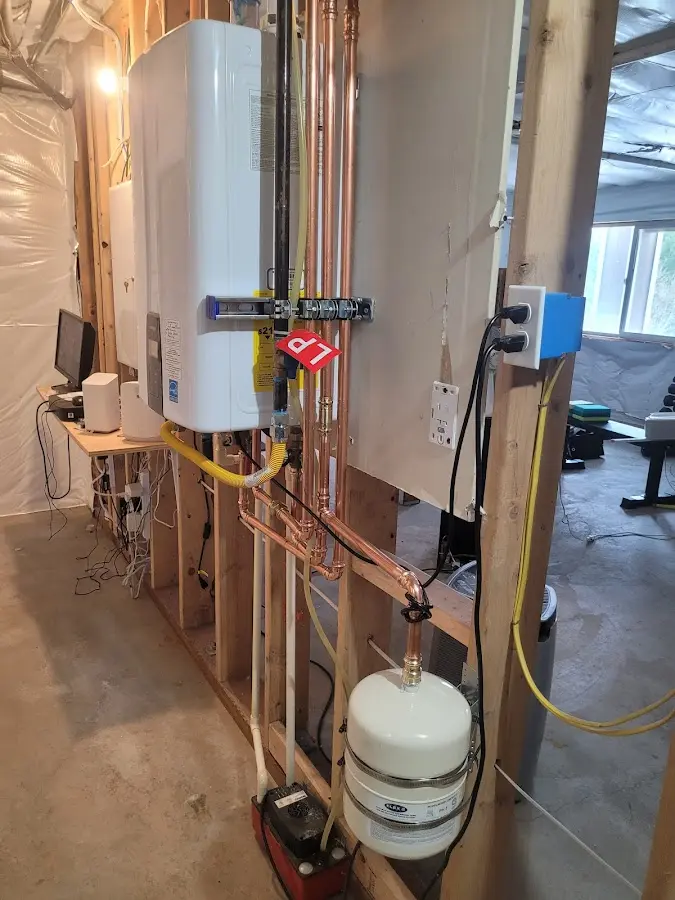 Licensed plumber repairing a kitchen sink in Totowa